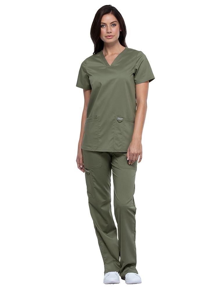 CNA wearing Cherokee Workwear Revolution women's V-Neck Scrub Top & Elastic Waistband Pull-On Scrub Pant in olive size large