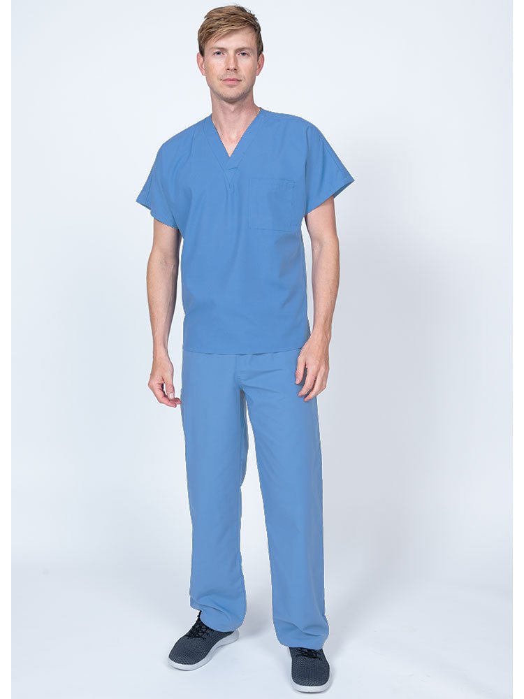 Young man wearing a Luv Scrubs Single Pocket V-Neck Scrub Top in ceil featuring a unisex fit.