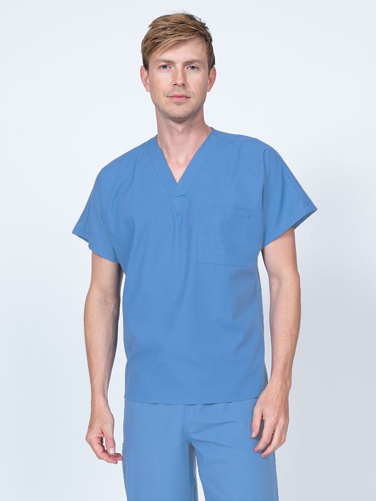 Man wearing a Luv Scrubs Unisex Single Pocket V-Neck Scrub Top in ceil with dolman sleeves and 1 chest pocket.