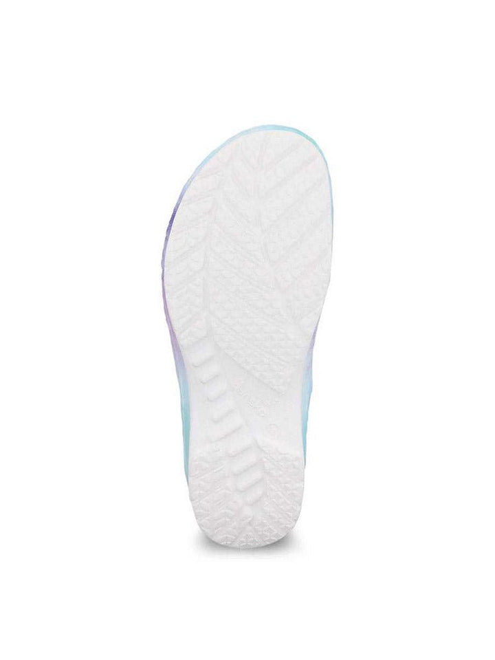 A single Dansko Kane Molded Nurse Clog in Tie Dye featuring a a channeled outsole to provide a durable, long-lasting wear.