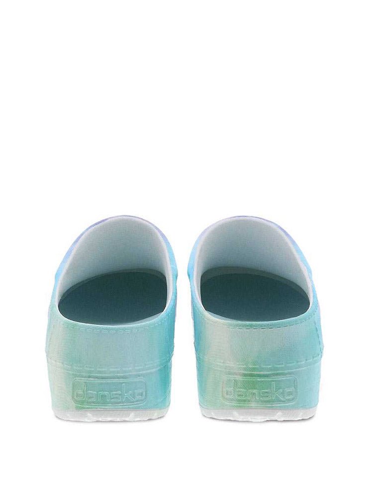 A pair of Dansko Kane Molded Nurse Clogs in Tie Dye with Dansko Natural Arch® technology for added support.