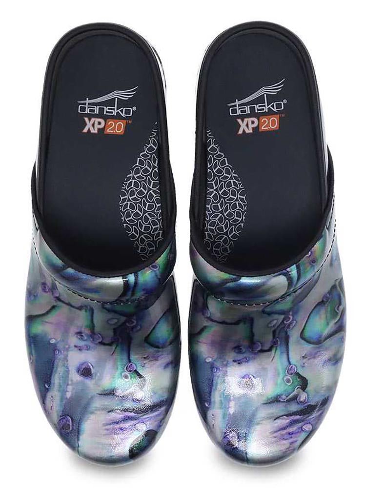 A pair of Dansko XP 2.0 Nurse Shoes in Silver Pearl Patent featuring a removable footbed.