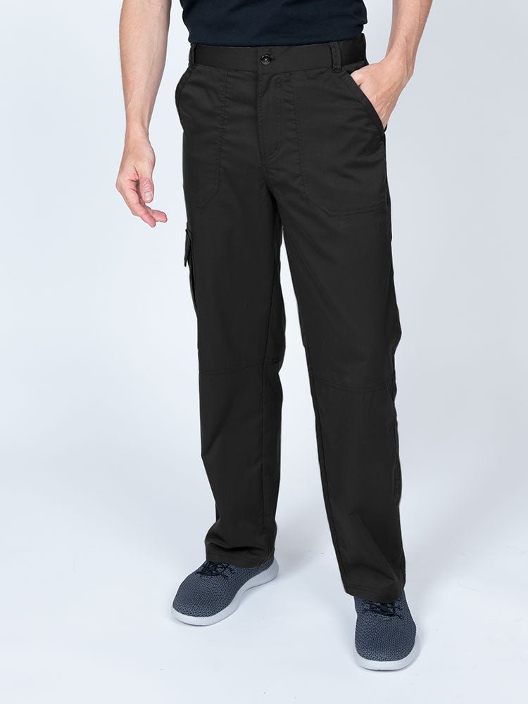 Man wearing an Epic by MedWorks Men's Button Front Scrub Pant in black with metal button front closure.