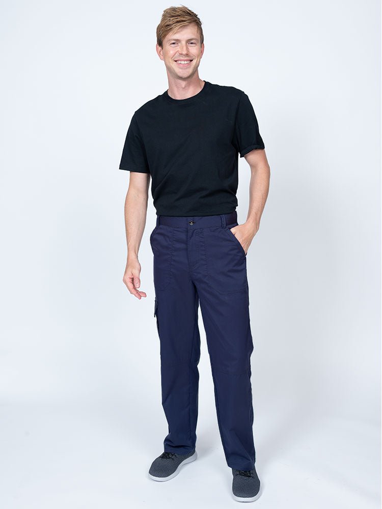 Male nurse practitioner wearing The Men's Button Front Scrub Pant from Epic by MedWorks in navy.