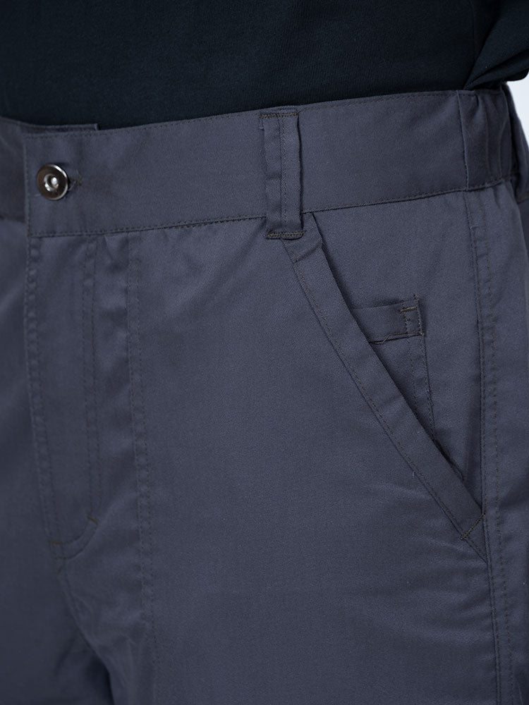 Man wearing an Epic by MedWorks Men's Button Front Scrub Pant in pewter with a 6 belt loop waistline.