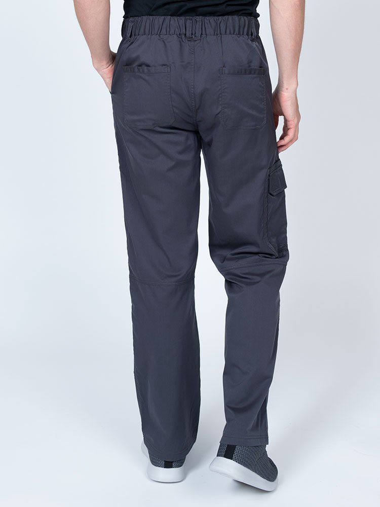 Male nurse wearing an Epic by MedWorks Men's Button Front Scrub Pant in pewter with 2 back pockets.