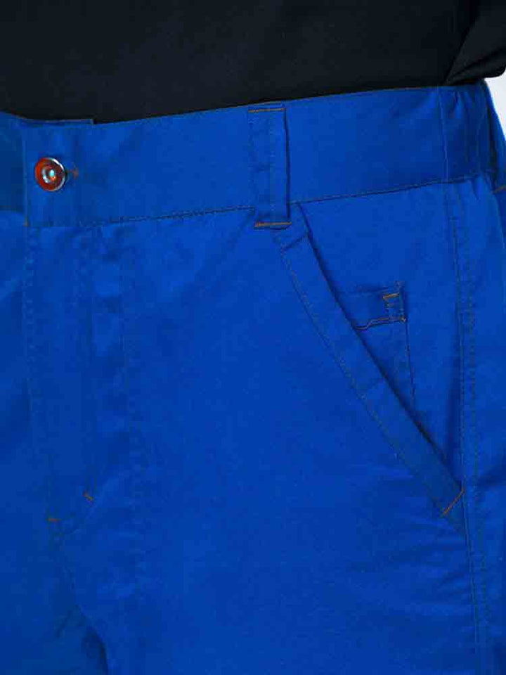 Man wearing an Epic by MedWorks Men's Button Front Scrub Pant in royal with a 6 belt loop waistline.