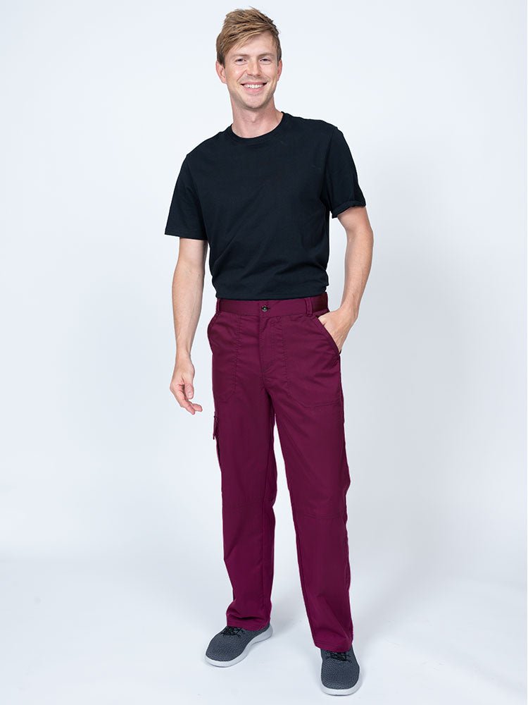 Male nurse practitioner wearing The Men's Button Front Scrub Pant from Epic by MedWorks in wine.