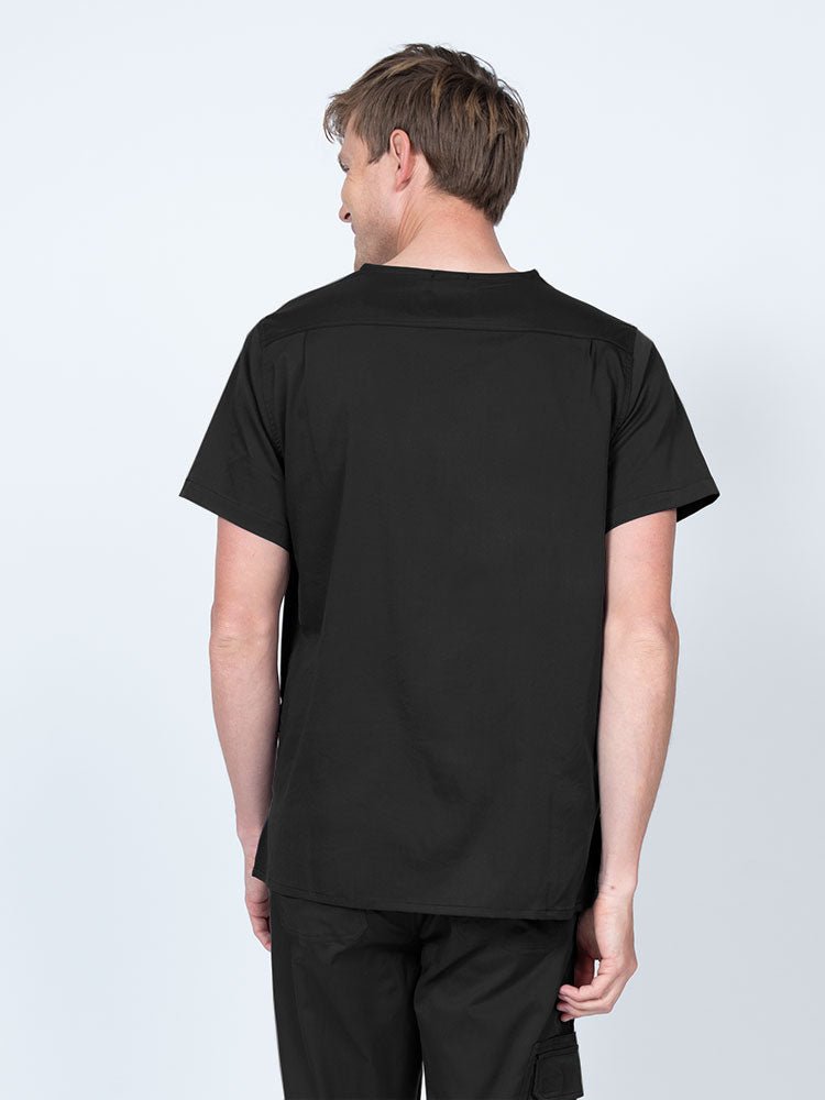Male nurse wearing an Epic by MedWorks Men's Scrub Top in black with a back yoke to keep a form-fitting look.