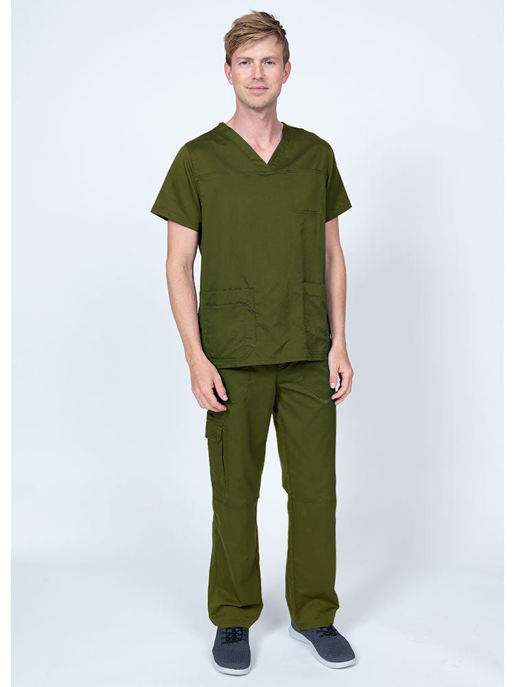 Man wearing an Epic by MedWorks Men's Scrub Top in olive with a super soft, 2-way stretch fabric.