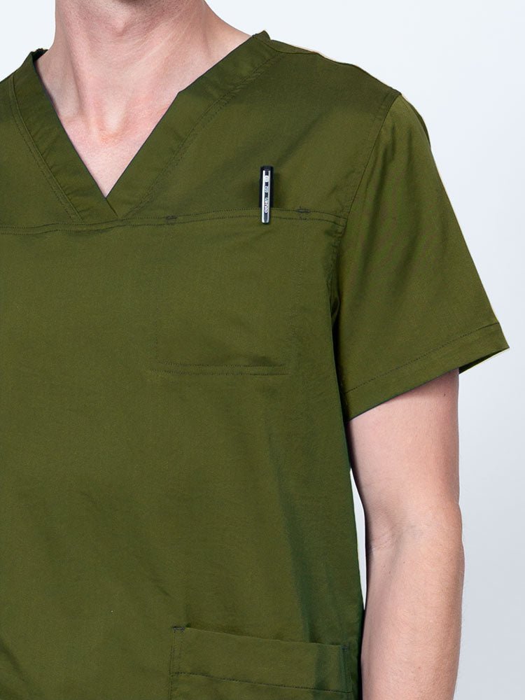 Male nurse wearing an Epic by MedWorks Men's Scrub Top in olive with a "hidden" front chest pocket.