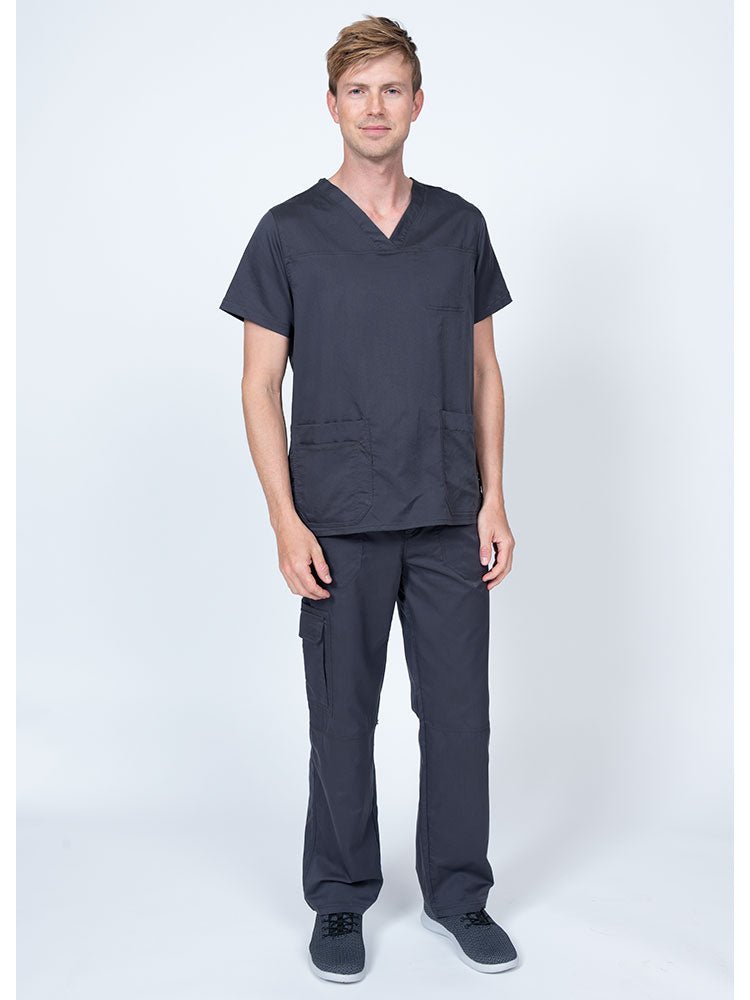 Man wearing an Epic by MedWorks Men's Scrub Top in pewter with a super soft, 2-way stretch fabric.