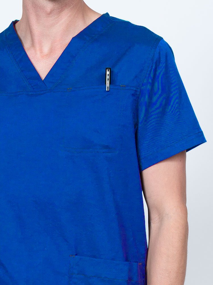 Male nurse wearing an Epic by MedWorks Men's Scrub Top in royal with a "hidden" front chest pocket.