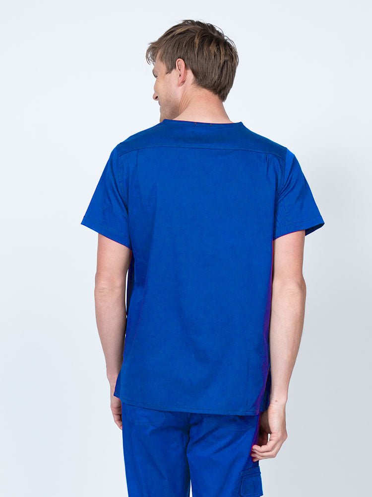 Male nurse wearing an Epic by MedWorks Men's Scrub Top in royal with a back yoke to keep a form-fitting look.