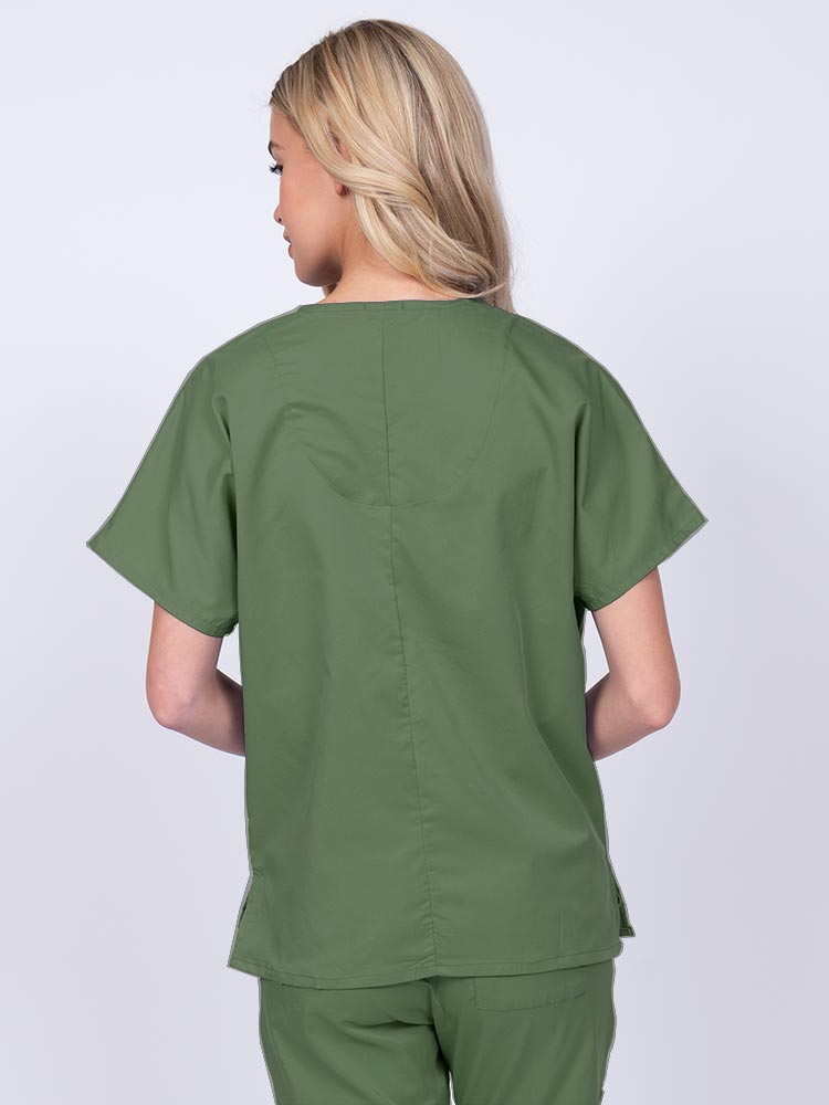 Woman wearing an Epic by MedWorks Unisex V-Neck Scrub Top in olive with a center back length of 27.5".