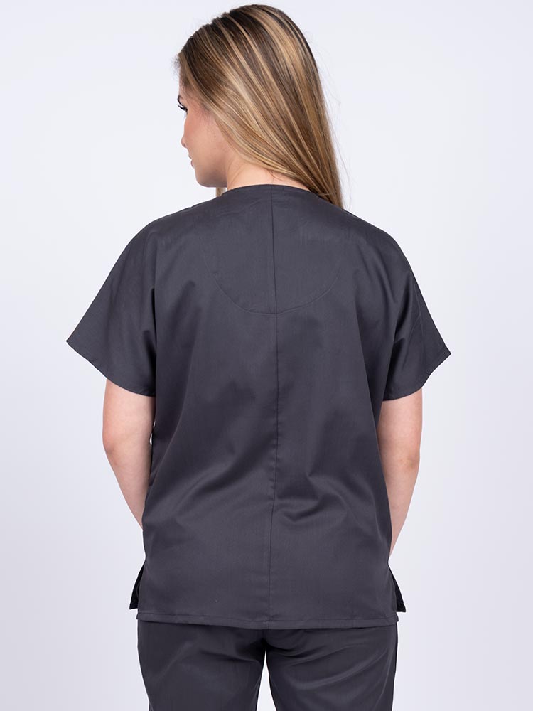 Woman wearing an Epic by MedWorks Unisex V-Neck Scrub Top in pewter with a center back length of 27.5".