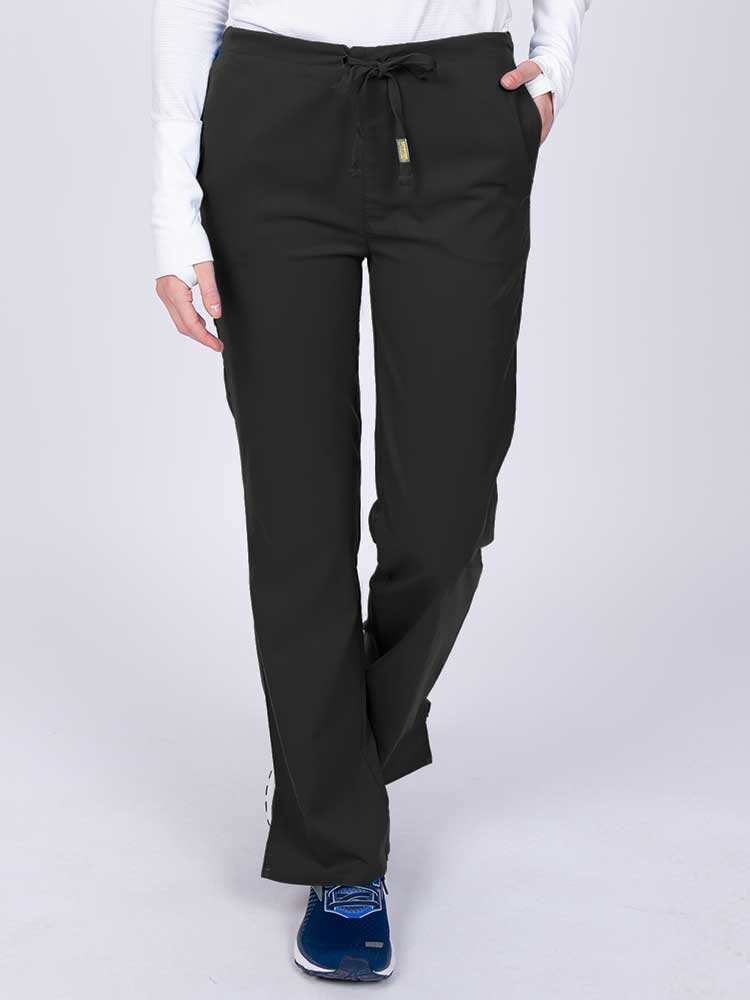 Young nurse wearing an Epic by MedWorks Women's Drawstring Flare Leg Scrub Pant in black with unique stretch fabric made of 77% Polyester, 21% Viscose, 2% Spandex.