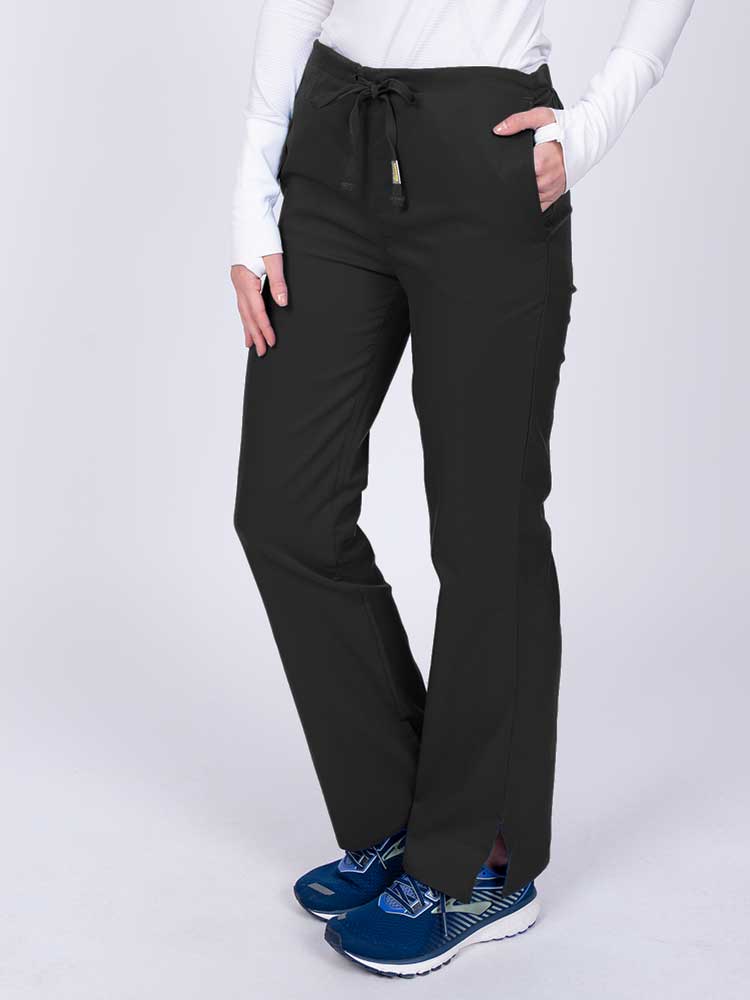 Nurse wearing an Epic by MedWorks Women's Drawstring Flare Leg Scrub Pant in black with side slits for additional mobility. 