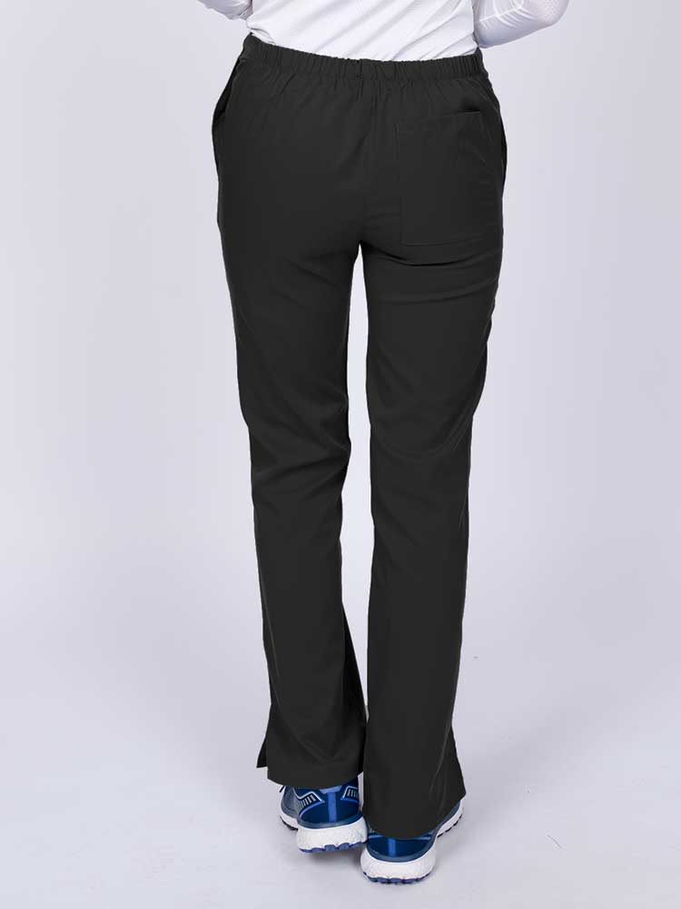 Young healthcare worker wearing an Epic by MedWorks Women's Drawstring Flare Leg Scrub Pant in black featuring a drawstring waist with back elastic.