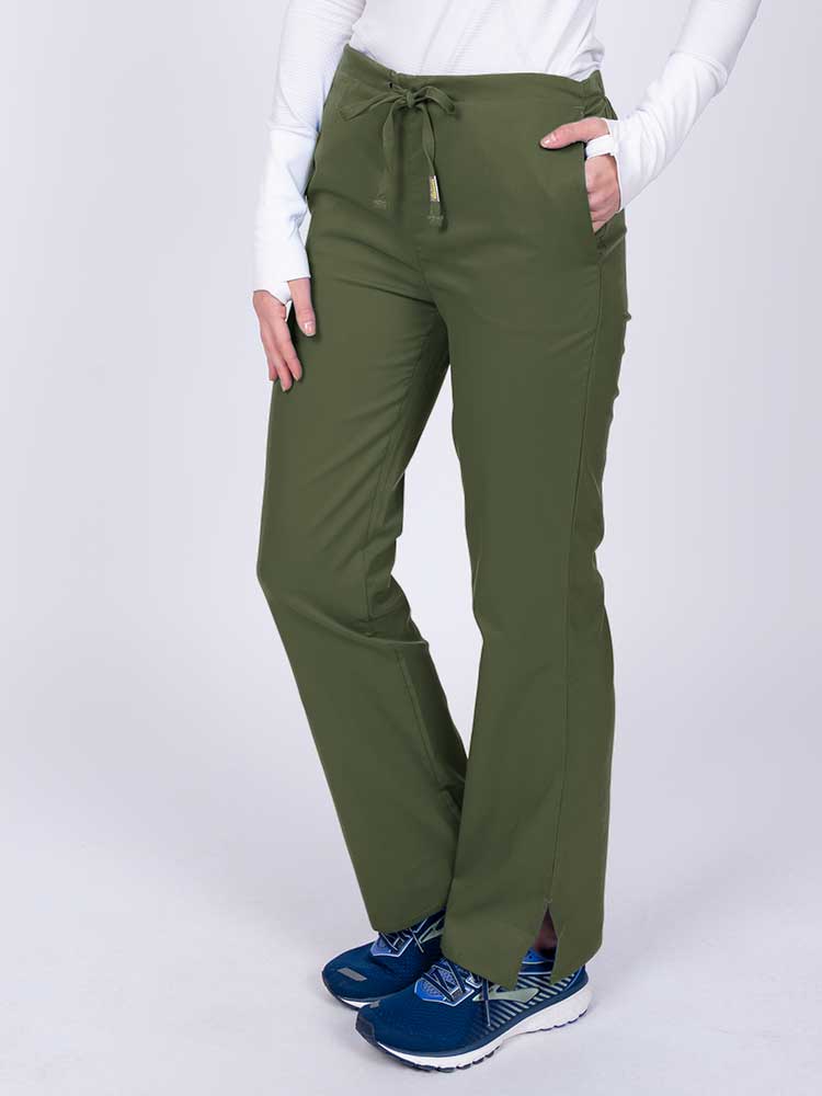Nurse wearing an Epic by MedWorks Women's Drawstring Flare Leg Scrub Pant in olive with side slits for additional mobility.