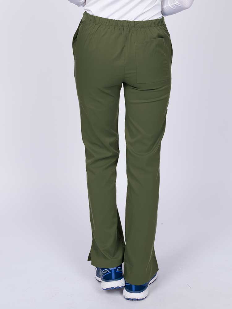 Young healthcare worker wearing an Epic by MedWorks Women's Drawstring Flare Leg Scrub Pant in olive featuring a drawstring waist with back elastic.