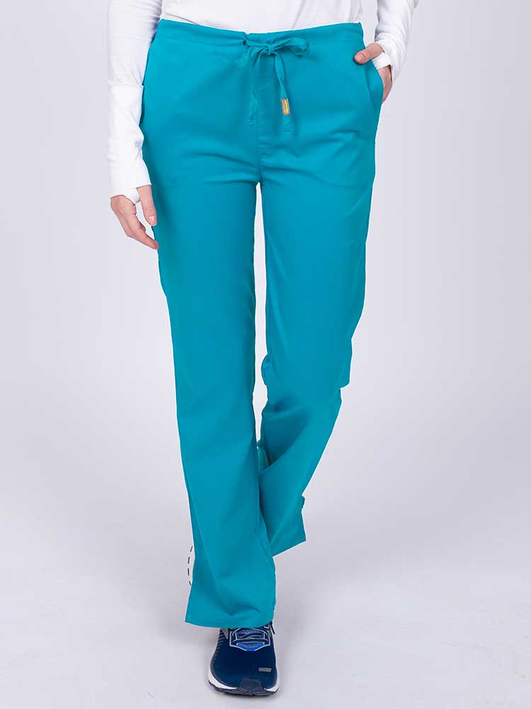 Young nurse wearing an Epic by MedWorks Women's Drawstring Flare Leg Scrub Pant in teal with unique stretch fabric made of 77% Polyester, 21% Viscose, 2% Spandex.