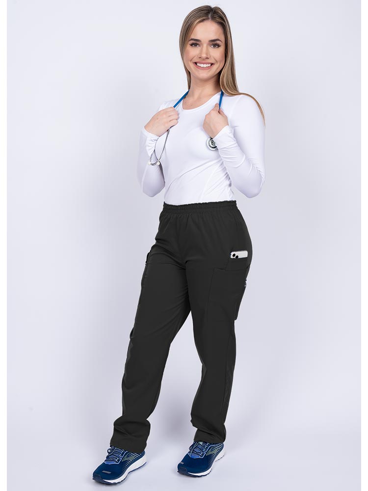 Healthcare worker wearing an Epic by MedWorks Women's Elastic Waist Scrub Pant in black with 1 cell phone pocket & and 1 pen slot.