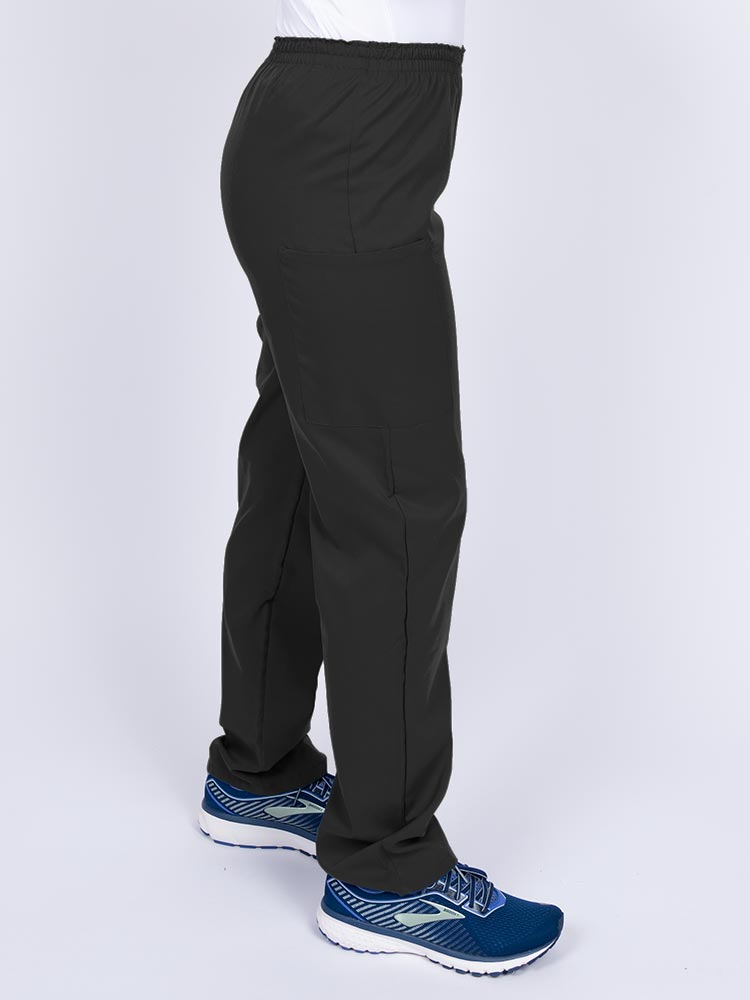 Woman wearing an Epic by MedWorks Women's Elastic Waist Scrub Pant in black with two cargo pockets.
