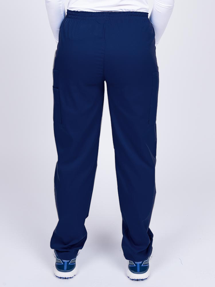 Nurse wearing an Epic by MedWorks Women's Elastic Waist Scrub Pant in navy with an innovative stretch fabric designed to move with you all day.
