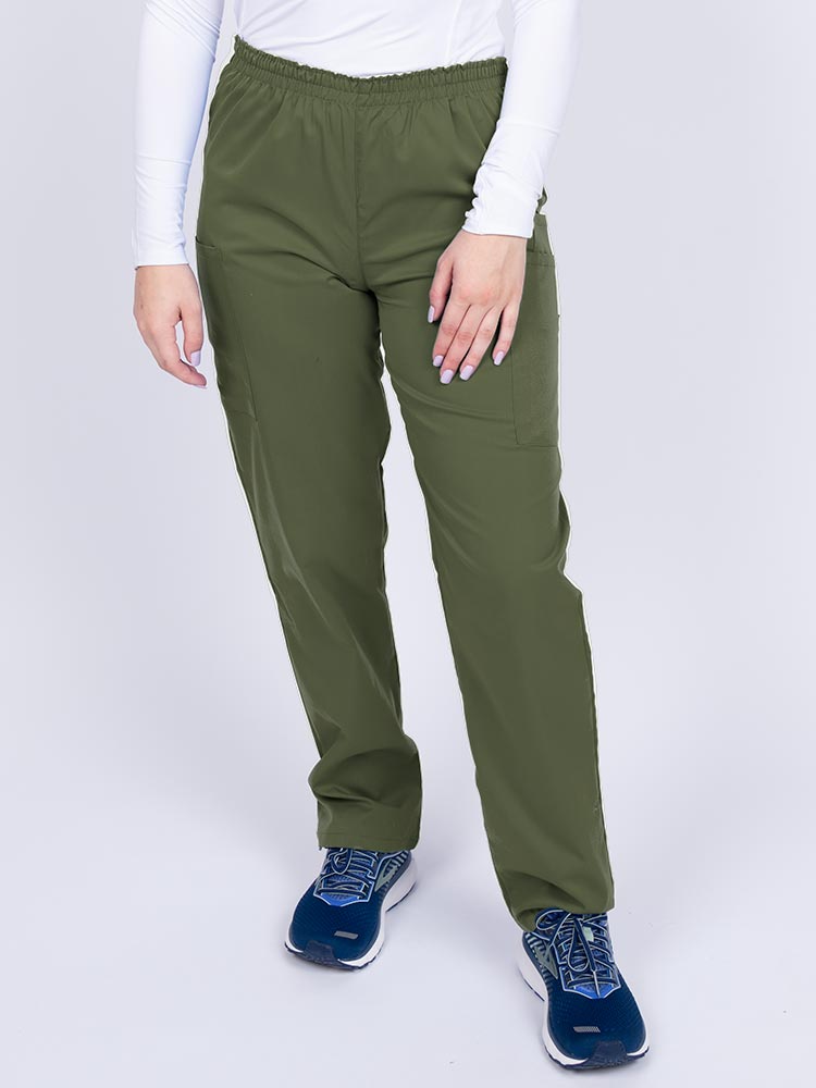Young woman wearing an Epic by MedWorks Women's Elastic Waist Scrub Pant in olive featuring a tapered leg and elastic waist.