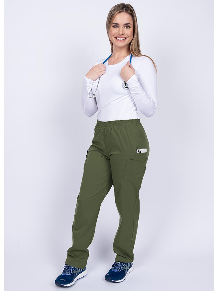 Healthcare worker wearing an Epic by MedWorks Women's Elastic Waist Scrub Pant in olive with 1 cell phone pocket & and 1 pen slot.