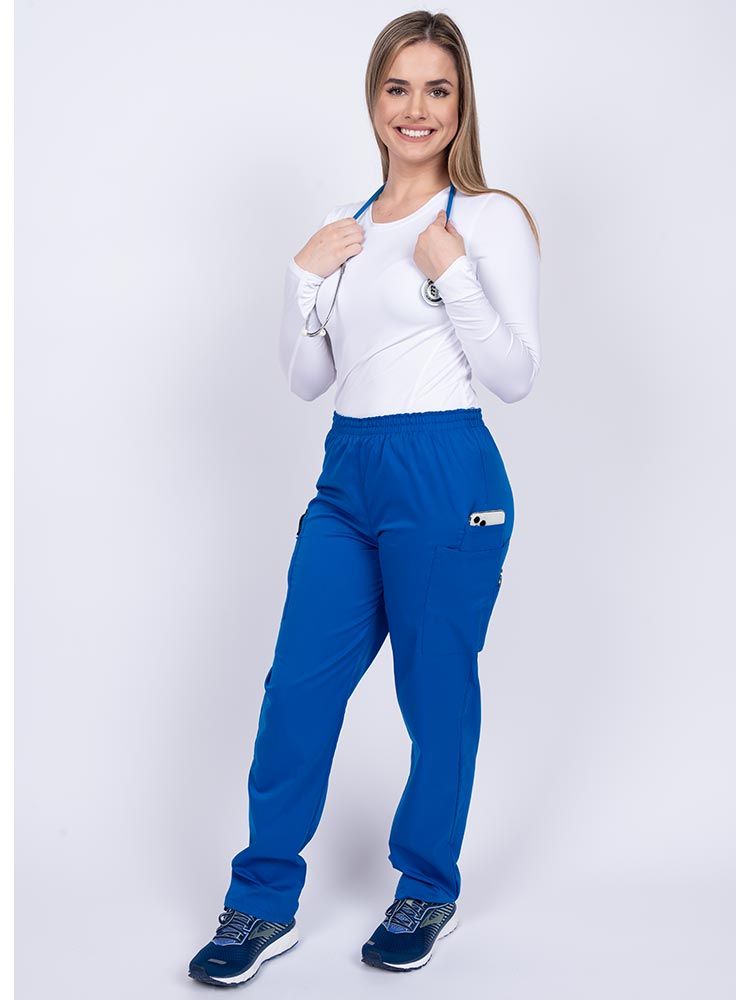 Healthcare worker wearing an Epic by MedWorks Women's Elastic Waist Scrub Pant in royal with 1 cell phone pocket & and 1 pen slot.