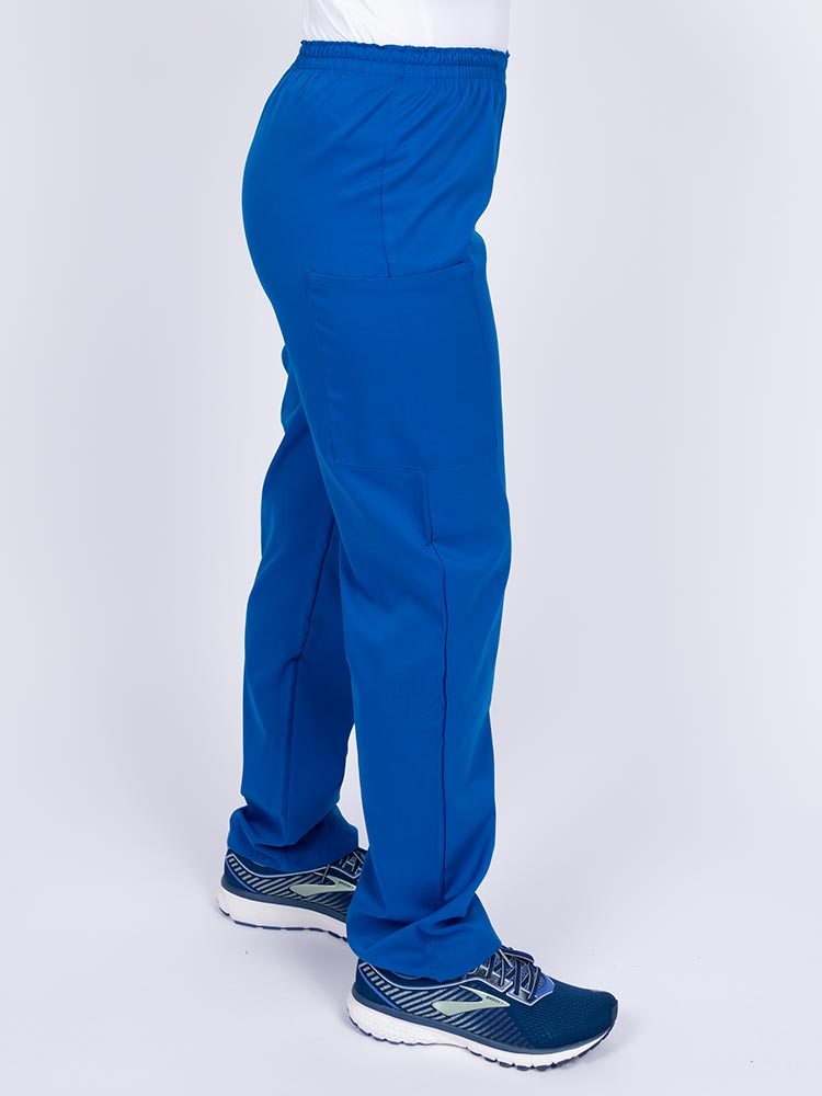 Woman wearing an Epic by MedWorks Women's Elastic Waist Scrub Pant in royal with two cargo pockets.