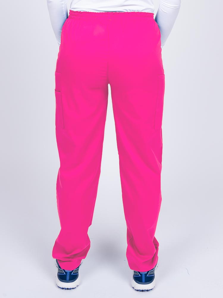 Nurse wearing an Epic by MedWorks Women's Elastic Waist Scrub Pant in shocking pink with an innovative stretch fabric designed to move with you all day.
