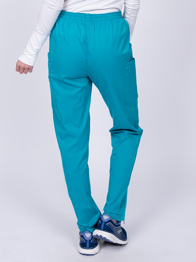 Nurse wearing an Epic by MedWorks Women's Elastic Waist Scrub Pant in teal with an innovative stretch fabric designed to move with you all day.