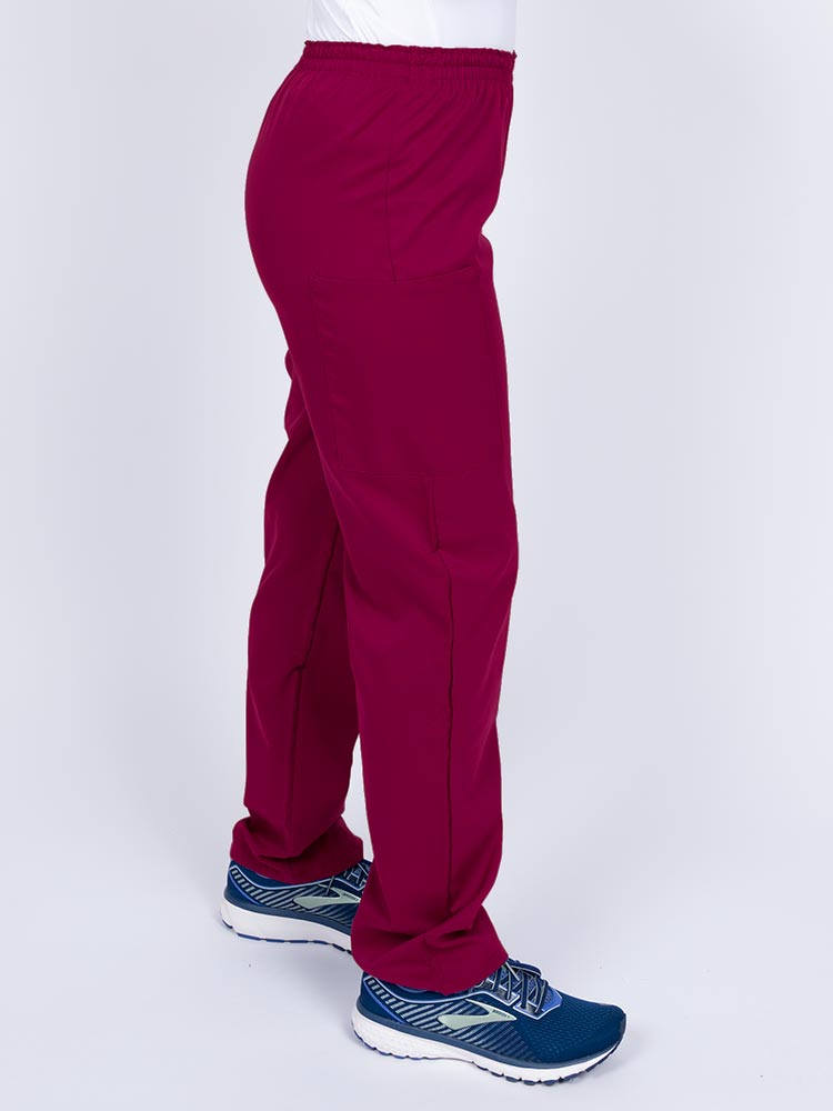 Nurse wearing an Epic by MedWorks Women's Elastic Waist Scrub Pant in wine with an innovative stretch fabric designed to move with you all day.