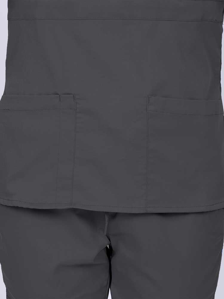 Woman wearing an Epic by MedWorks Women's Mock Wrap Scrub Top in pewter featuring two front patch pockets.
