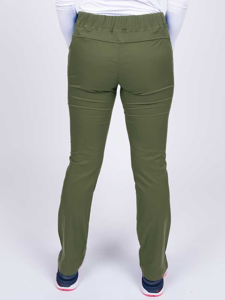 Nurse wearing an Epic by MedWorks Women's Blessed Skinny Yoga Scrub Pant in olive with a knit waistband.