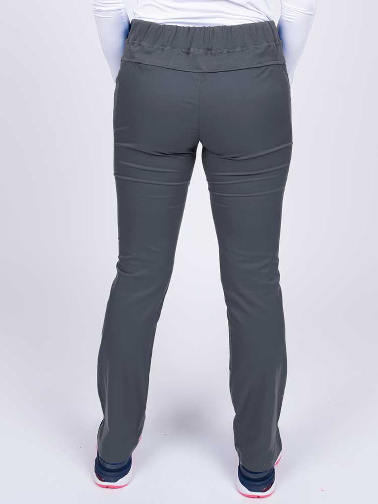 Nurse wearing an Epic by MedWorks Women's Blessed Skinny Yoga Scrub Pant in pewter with a knit waistband.