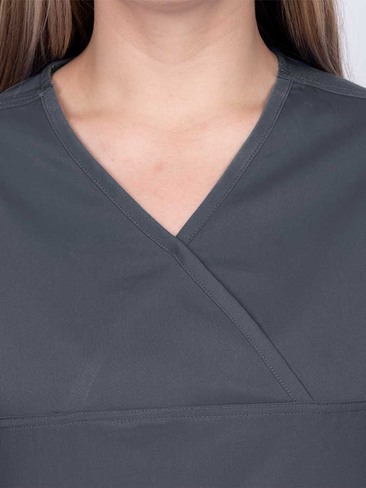 Woman wearing an Epic by MedWorks Women's Scrub Top in pewter with a Y-neckline.