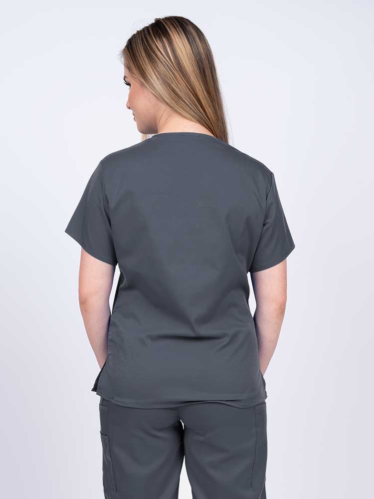 Woman wearing an Epic by MedWorks Women's Y-Neck Scrub Top in pewter with a center back length of 26".