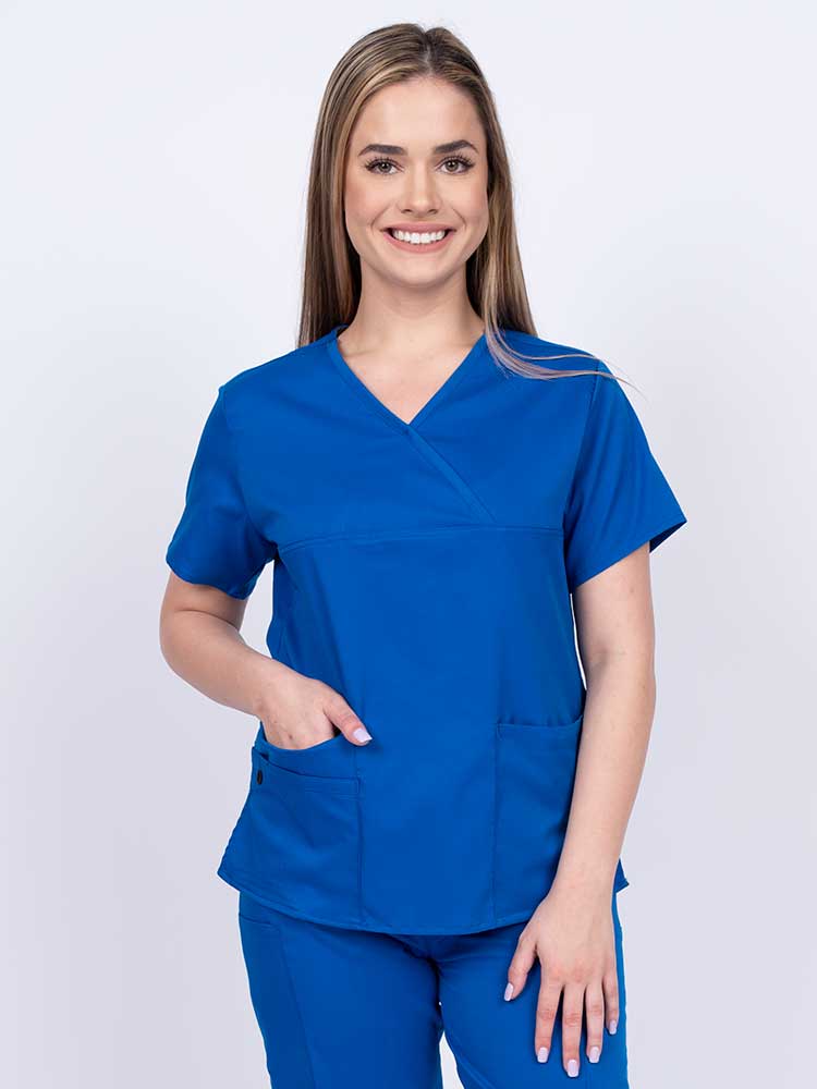 Woman wearing an Epic by MedWorks Women's Y-Neck Scrub Top in royal with a super soft, 2-way stretch fabric designed to move with your body all day long.