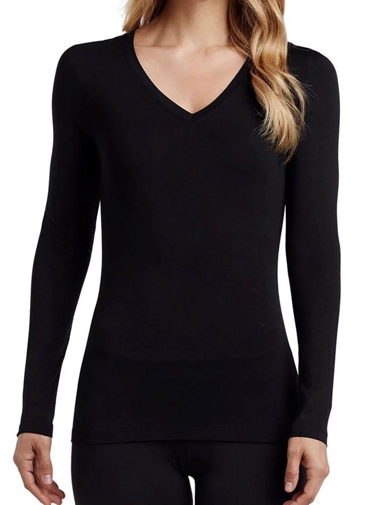A young female Nurse Practitioner wearing a Flexibilitee Women's V-neck Long Sleeve Tee in Black size medium.