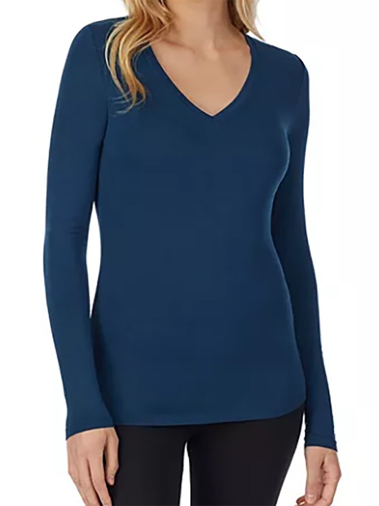 A young female nurse wearing a Flexibilitee Women's V-neck Long Sleeve Tee in Navy featuring classic V-neck design and long sleeves.