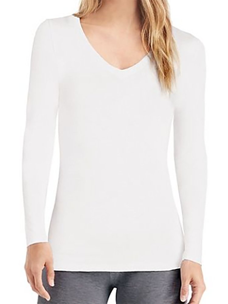 A young female LPN wearing a Flexibilitee Women's V-neck Long Sleeve Tee in White featuring a rib-knit collar and a junior fit.