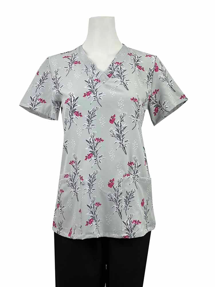A mannequin wearing a Luv Scrubs by Med Works Women's Print Scrub Top in "Star Spangled Gnomes" size Medium featuring a total of 3 pockets for maximum storage space.