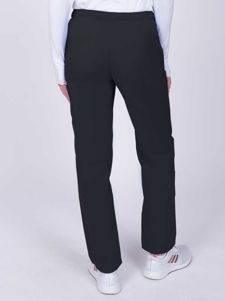 Nurse wearing a Luv Scrubs by MedWorks Women's Elastic Waist Cargo Pant in black with an elastic and drawstring waist.