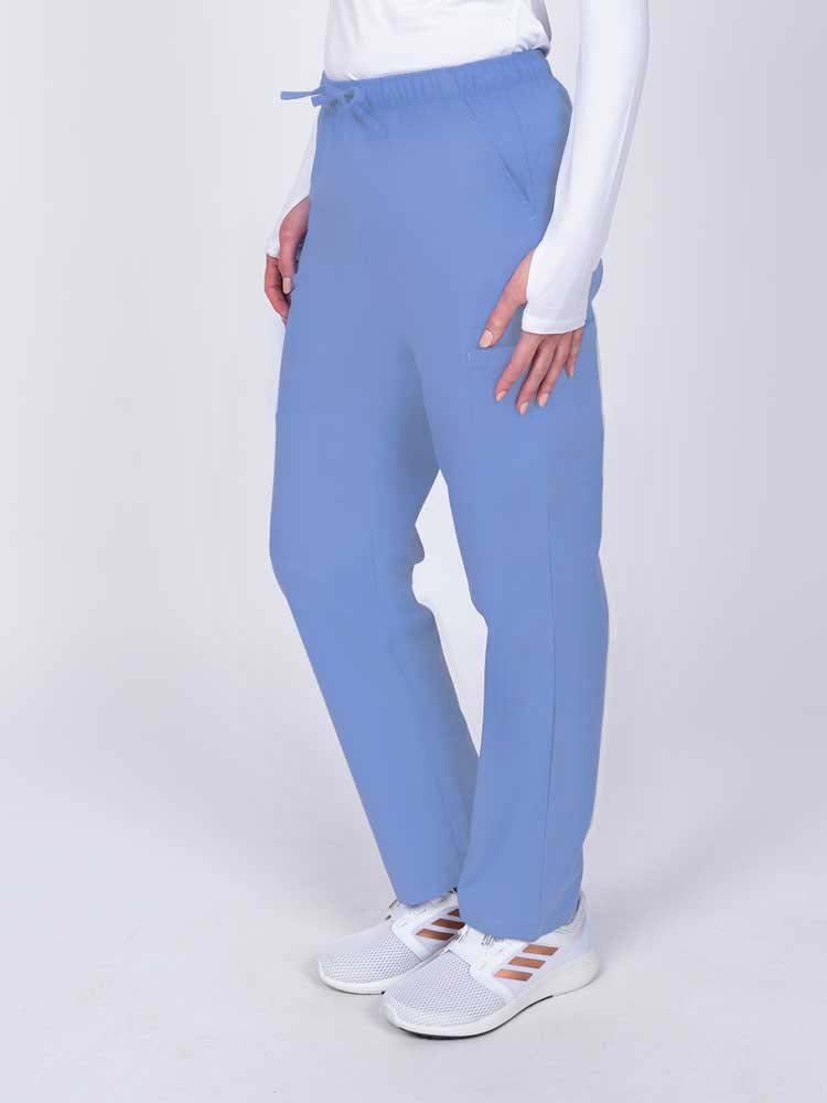 Woman wearing a Luv Scrubs by MedWorks Women's Elastic Waist Cargo Pant in ceil with 2 front slash pockets.