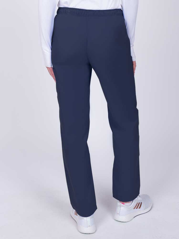 Nurse wearing a Luv Scrubs by MedWorks Women's Elastic Waist Cargo Pant in navy with an elastic and drawstring waist.