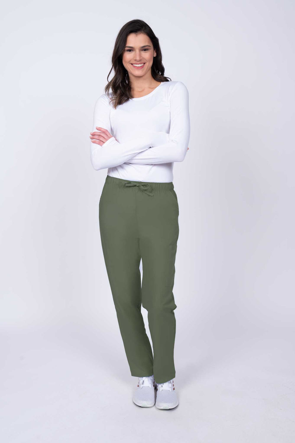 Young healthcare worker wearing a Luv Scrubs by MedWorks Women's Elastic Waist Cargo Pant in olive featuring a natural rise and straight legs.